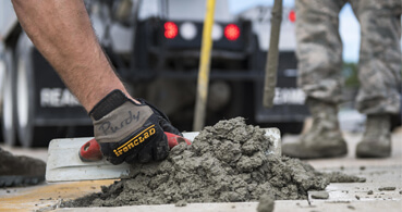 concrete being spread with a trowel